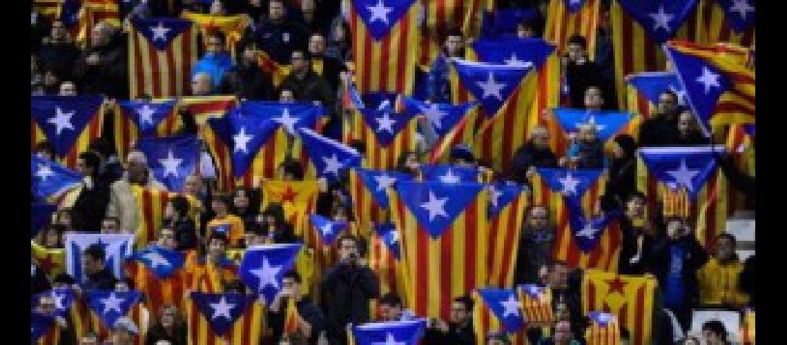 BARCELONA SPAIN - JANUARY 02-  Supporters hols up Catalonian Pro-independence flags during a friendly match between Catalonia and Nigeria at Cornella-El Prat Stadium on January 2 2013 in Barcelona Spain  (Photo by David RamosGetty Images)