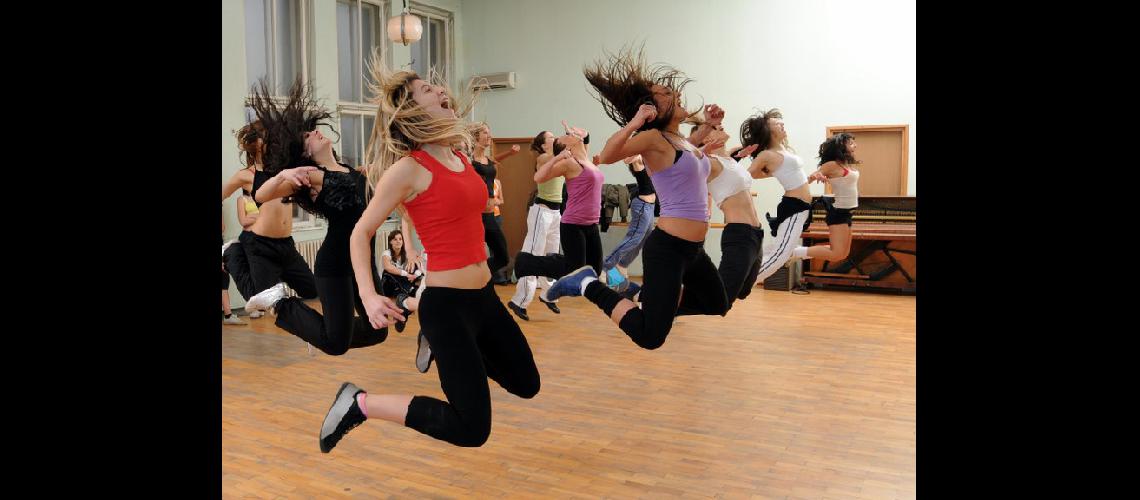 Young girls in the high jump practicing modern dance